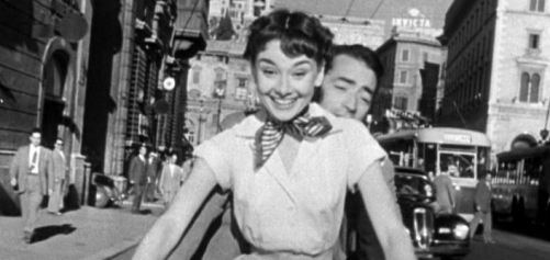 90a01-audrey_hepburn_and_gregory_peck_on_vespa_in_roman_holiday_trailer.jpg